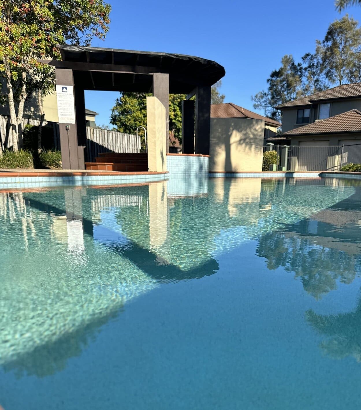 The swimming pool with its waterfall feature